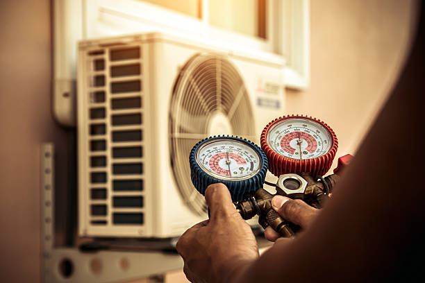 Professional Heat Pump Repair technician working in Russell, IL